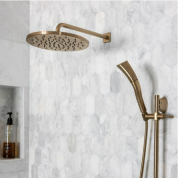 grey and white marble picket shaped shower wall tiles with bronze hardware.