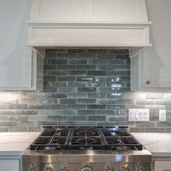 Blue tile backsplash in San Marcos kitchen. Installation by GWH Flooring company