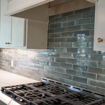 Blue tile backsplash in San Marcos kitchen. Installation by GWH Flooring company