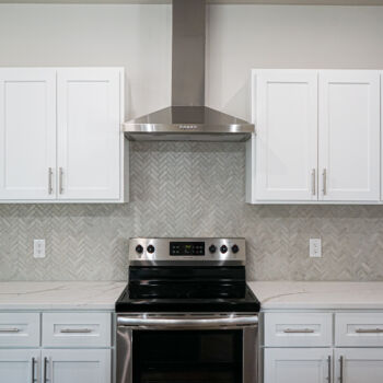 grey herringbone subway tile backsplash installed by GWH Flooring contractors