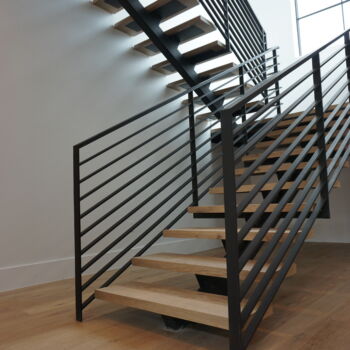 Floating wood stairs installed by GWH Flooring