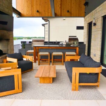 Outdoor living/kitchen area with white limestone floor tiles installed by GWH Flooring.